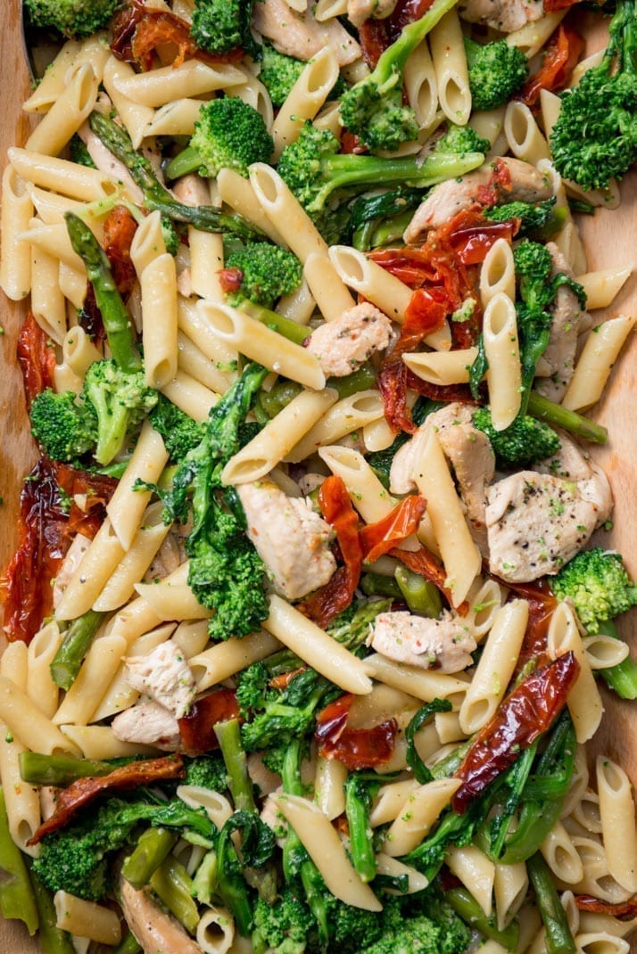This pasta dish is a quick family pleaser with penne, chicken, sundried tomatoes, broccoli, rapini and asparagus it's packed with flavour.