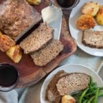 overhead food image of italian meatloaf served with green beans and roasted potatoes